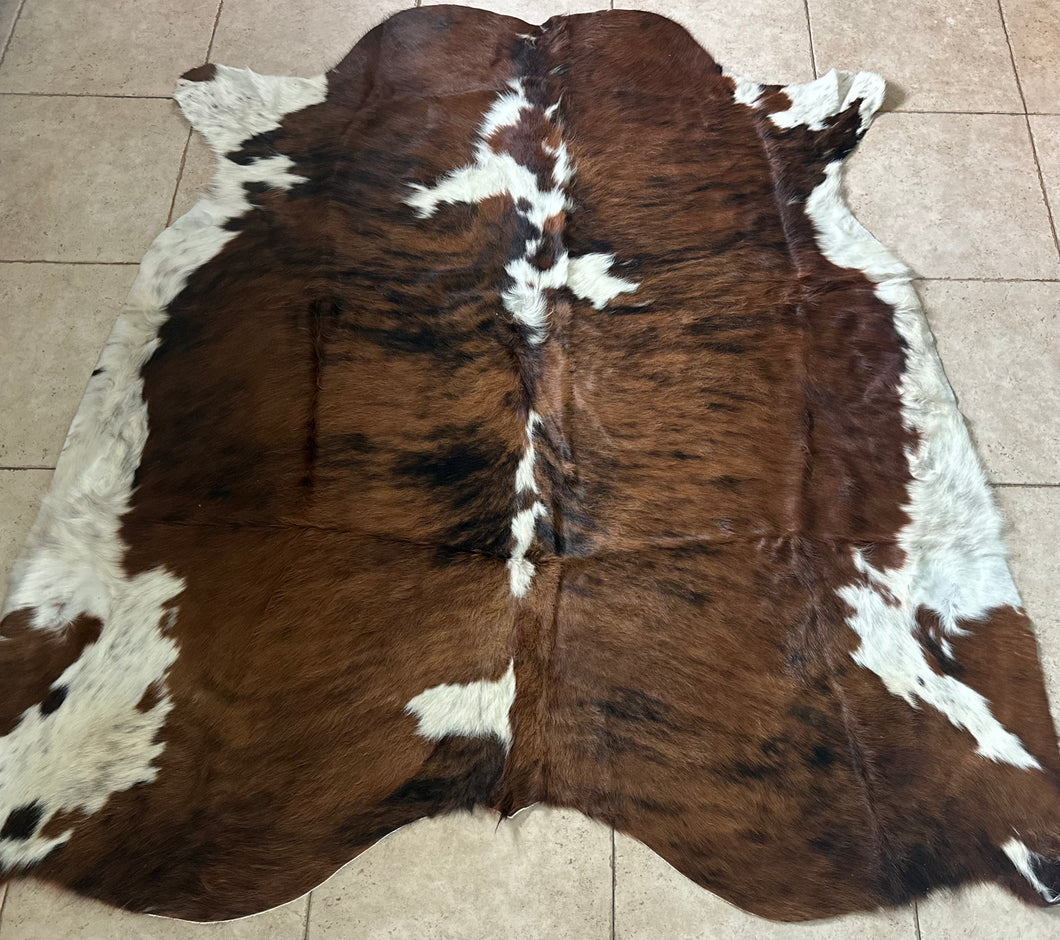 Large tricolor Brazilian cowhide rug